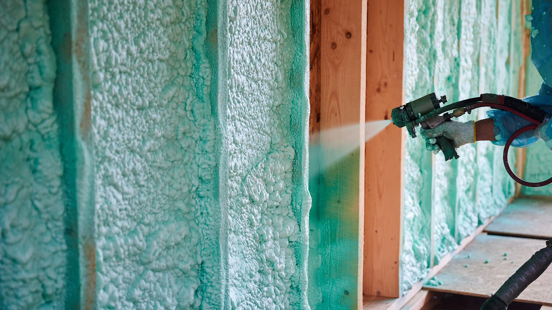 Builder insulating wooden frame house